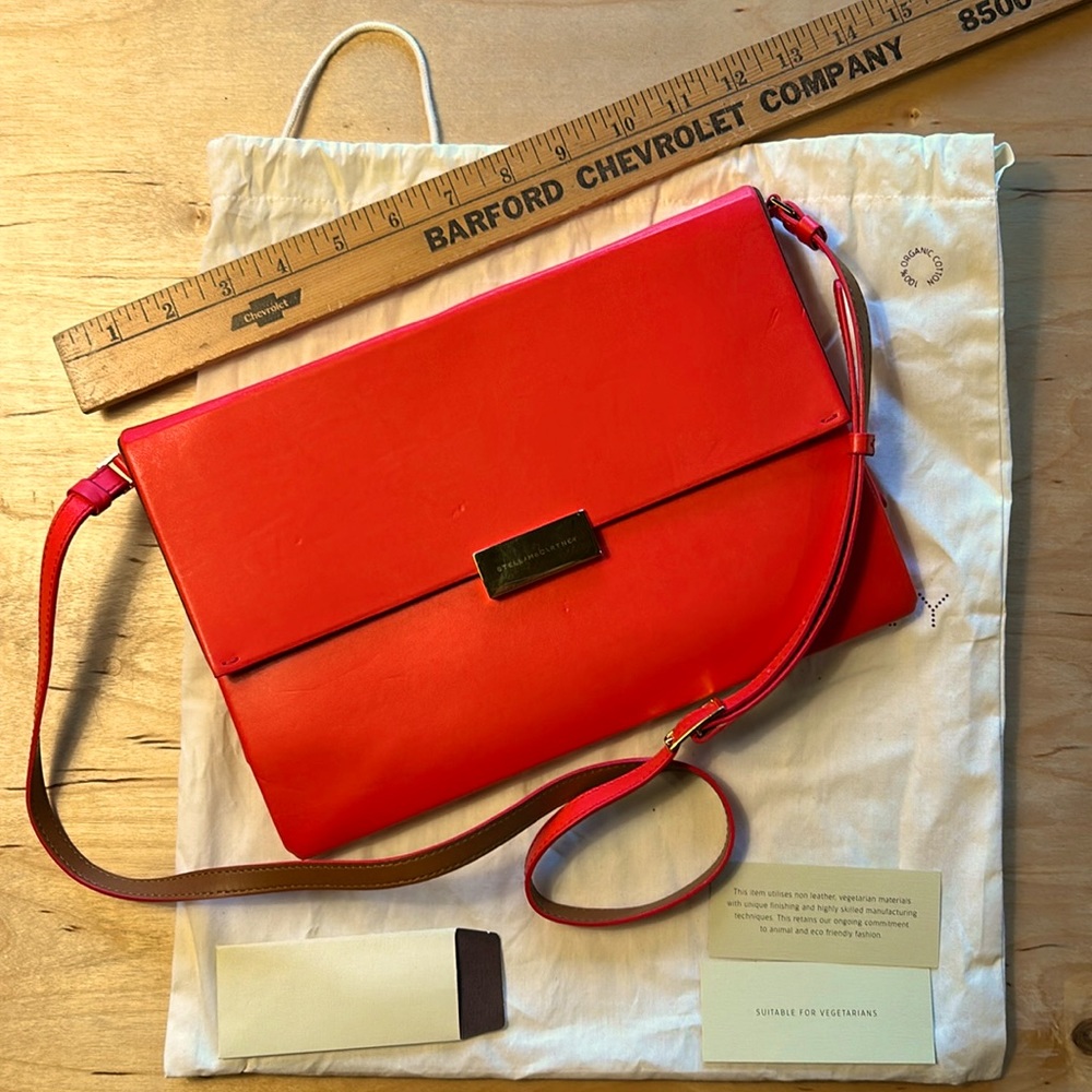 Stella McCartney cross body bag, used once. Lovely vibrant orange. With dust bag